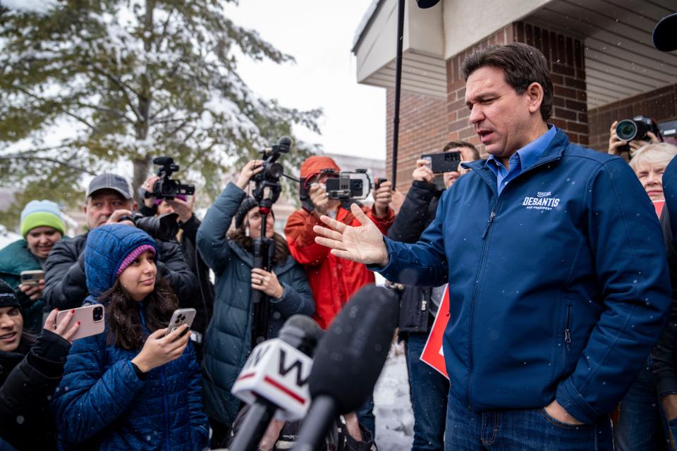 Florida Gov. Ron Desantis speaks to members of the media outside a DeSantis campaign office in Urbandale, Iowa, Friday, Jan. 12, 2024.