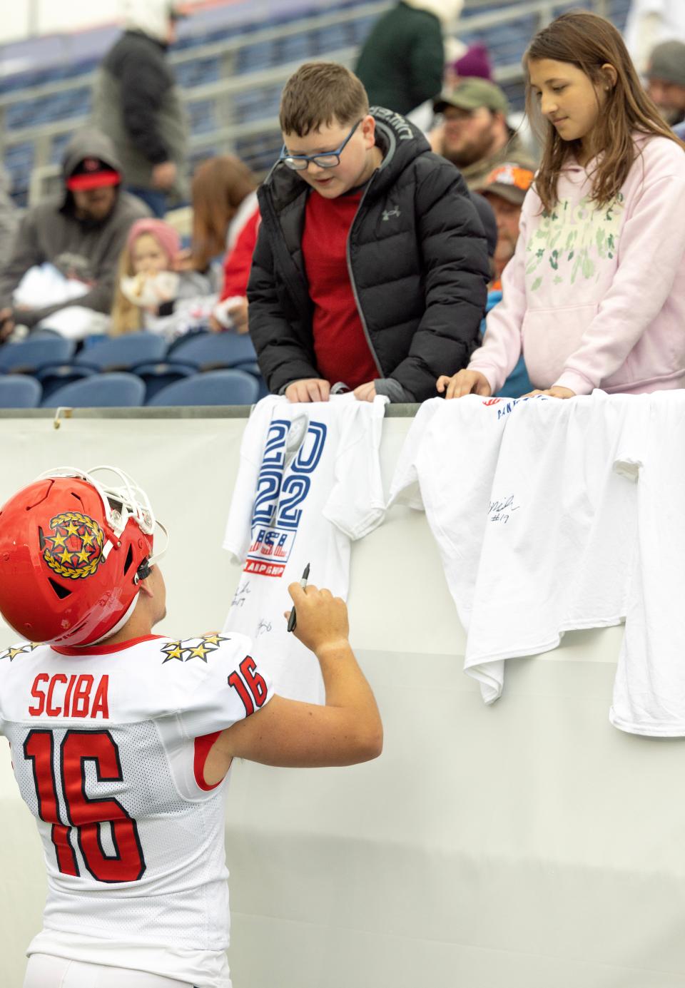 New Jersey Generals kicker Nick Sciba signs t-shirts for fans Tyler,12, and his sister Sammie, 10, Archual of Akron at Tom Benson Hall of Fame Stadium Sunday, April 23, 2023. 