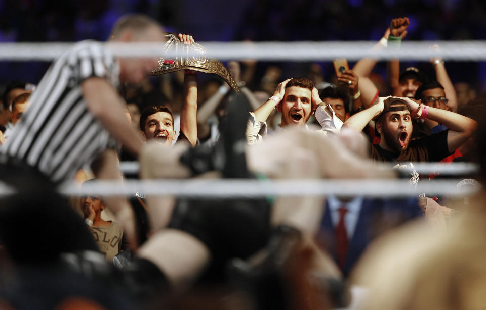 In this Thursday, Oct. 31, 2019 photo, Saudi fans shout during a wrestling match of the WWE Crown Jewel matches at King Fahd International Stadium in Riyadh, Saudi Arabia. Prince Abdulaziz bin Turki al-Faisal, who leads the General Sports Authority, said during an interview with the Associated Press that he invites anyone who's interested or curious about Saudi Arabia to come and visit the country after it opened tourist visas to people from around the world three months ago. (AP Photo/Amr Nabil)
