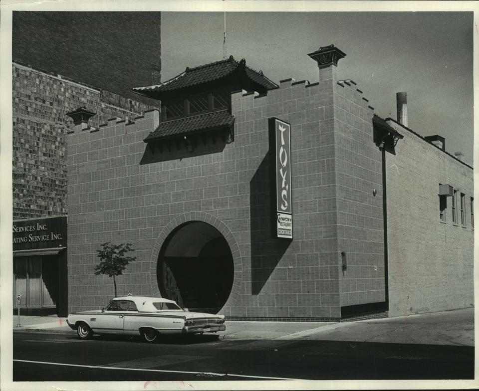 In this 1969 photo, a lone car parks in front of Toy's in the Chinese restaurant's last location in downtown Milwaukee, on N. King Drive near Kilbourn Avenue. Toy's first opened downtown in 1904, then moved to a six-story building on Second Street before the King Drive location was built after World War II. It closed in 2002.