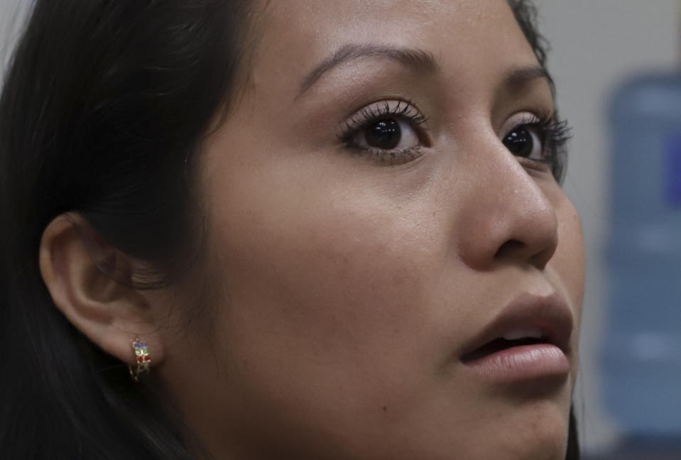 Evelyn Beatriz Hernandez attends her second trial at court, after her 30-year sentence for abortion was overturned in February, in Ciudad Delgado on the outskirts of San Salvador, El Salvador, Monday, July 15, 2019. The young woman who was prosecuted under the country's highly restrictive abortion laws after birthing a baby into a pit latrine says she had no idea she was pregnant, as a result of a rape. (AP Photo/Salvador Melendez)