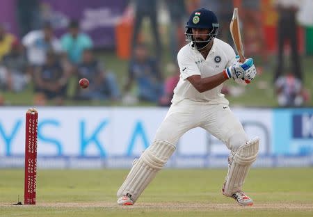 Cricket - Sri Lanka v India - First Test Match - Galle, Sri Lanka - July 26, 2017 - India's cricketer Cheteshwar Pujara plays a shot. REUTERS/Dinuka Liyanawatte