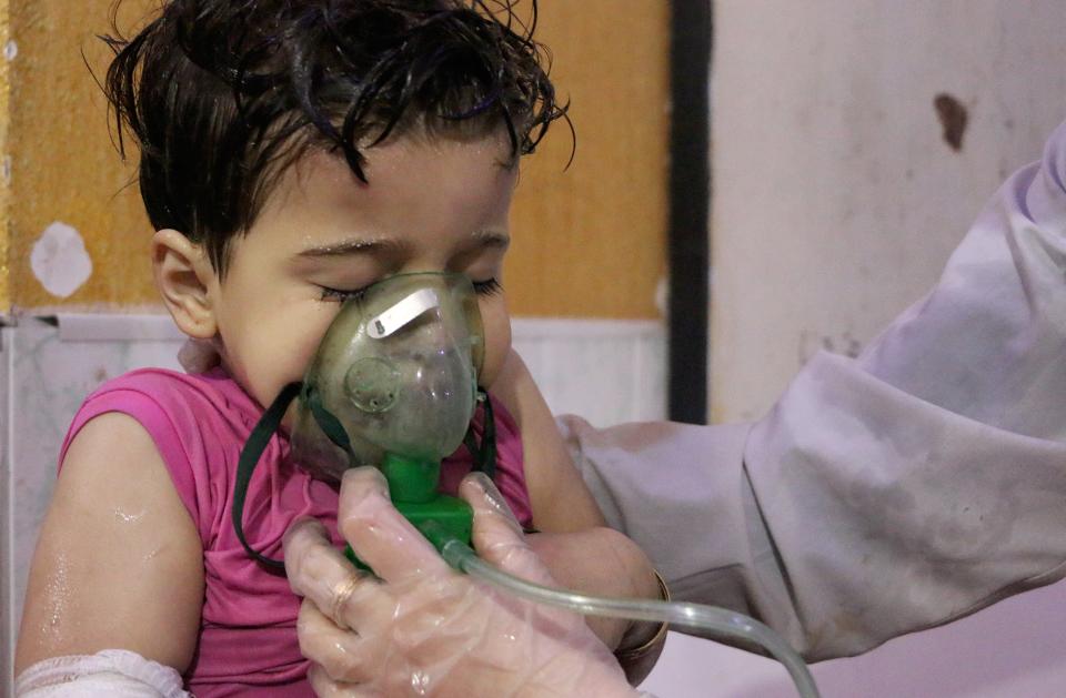 <p>An affected Syrian kid receives medical treatment after Assad regime forces allegedly conducted poisonous gas attack to Douma town of Eastern Ghouta in Damascus, Syria on April 8, 2018. (Photo: Mouneb Taim/Anadolu Agency/Getty Images) </p>