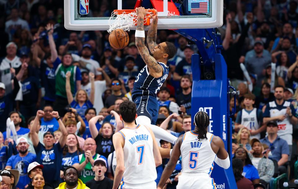 May 11, 2024; Dallas, Texas, USA; Dallas Mavericks forward P.J. Washington (25) dunks past Oklahoma City Thunder forward Chet Holmgren (7) during the second half during game three of the second round for the 2024 NBA playoffs at American Airlines Center.