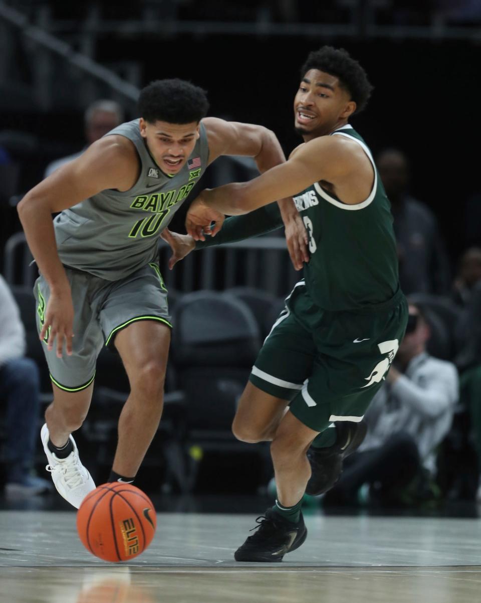 Michigan State guard Jaden Akins defends against Baylor guard RayJ Dennis during the first half of MSU's 88-64 win over Baylor on Saturday, Dec.16, 2023, at Little Caesars Arena.