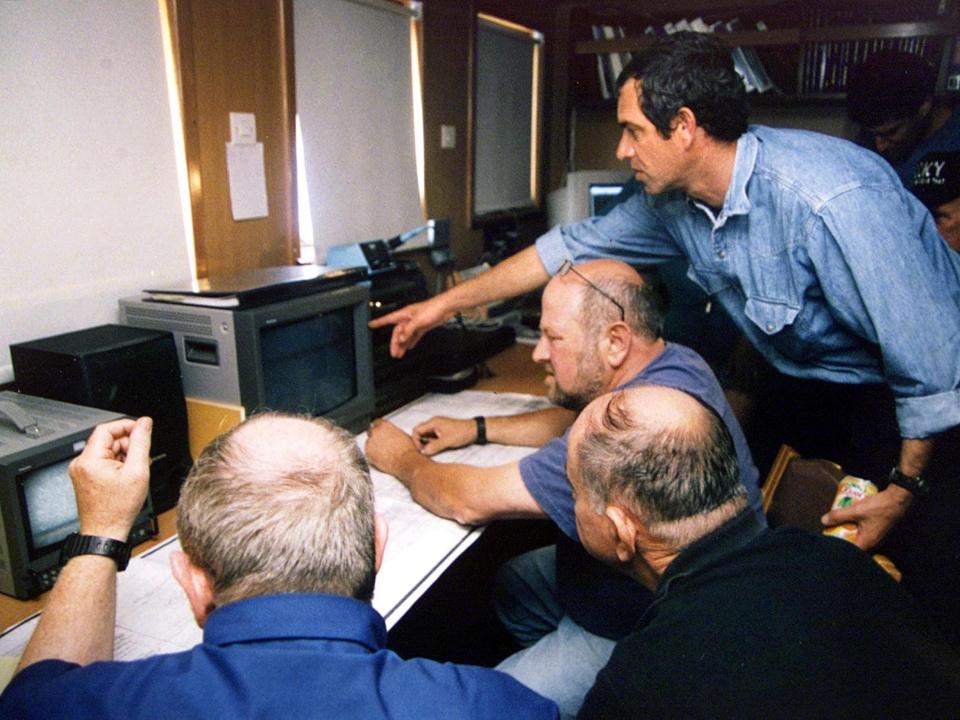 A team of Israeli former naval officers watch TV footage taken by the US search team that found the INS Dakar south of Crete.