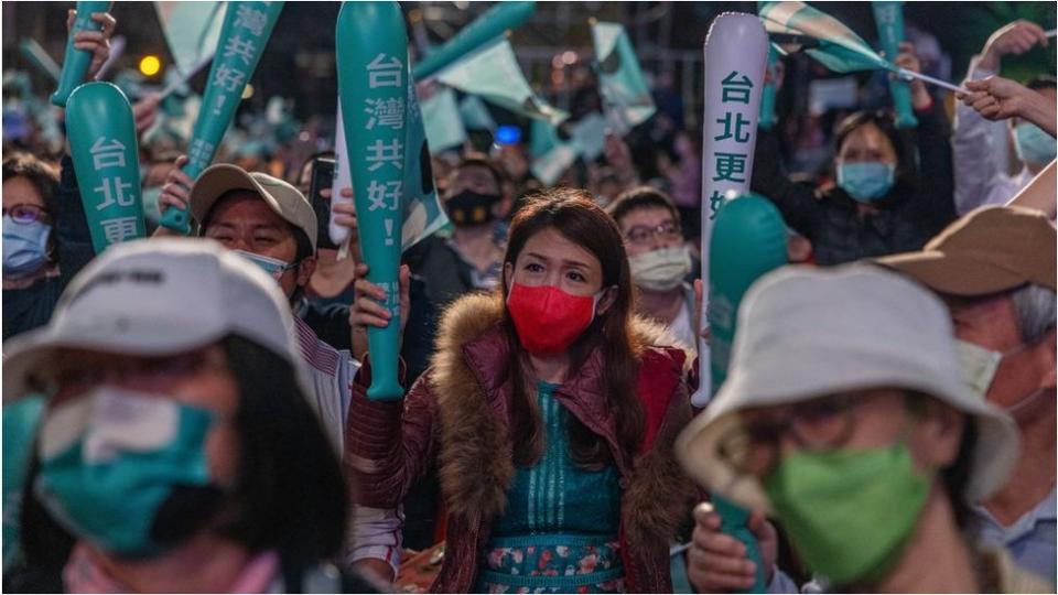 Supporters of Taipei mayoral hopeful Chen Shih-chung listen to the Democratic Progressive Party (DPP) candidate's concession speech on November 26, 2022 in Taipei,