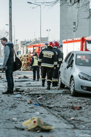 Firefighters check the site where a building collapsed in Poznan, Poland, March 4, 2018 in this picture obtained from social media. Courtesy of INSTAGRAM/ @PAWEL_ALTERNATYWNA /via REUTERS