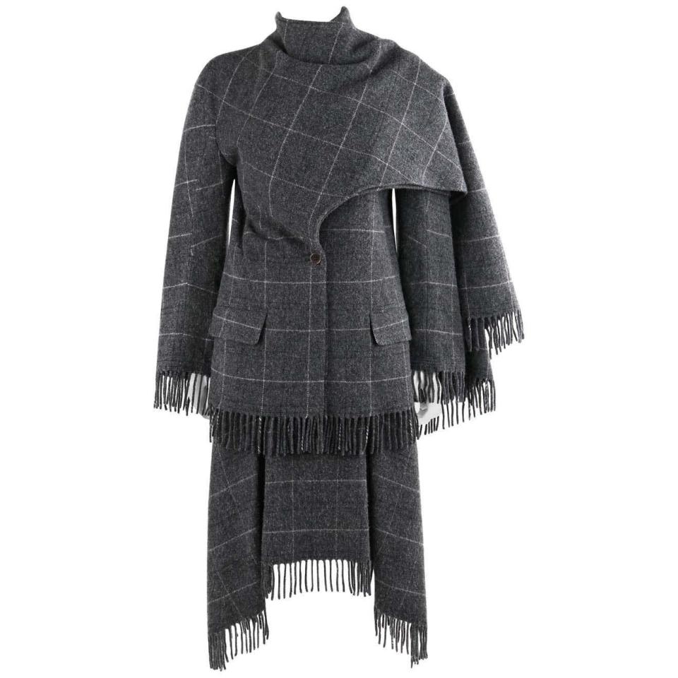 <p><a class="link " href="https://www.1stdibs.com/en-gb/fashion/clothing/coats-outerwear/alexander-mcqueen-w-1999-overlook-gray-check-fringe-jacket-skirt-set/id-v_11461822/?currency=gbp&modal=intlWelcomeModal" rel="nofollow noopener" target="_blank" data-ylk="slk:SHOP NOW;elm:context_link;itc:0;sec:content-canvas">SHOP NOW</a></p><p>If one had to choose an outfit to brave a haunted hotel in the depths of winter, this dramatic wool skirt suit would be an apt choice. After all, it’s from ‘The Overlook’ autumn/winter 1999 show, named after the hotel in Stanley Kubrick’s 1980 film, The Shining. McQueen created an appropriately eerie, snowglobe-like stage upon which to present bubble-hemmed skater skirts, sweeping tailored coats and architectural suits like this one.<br></p>