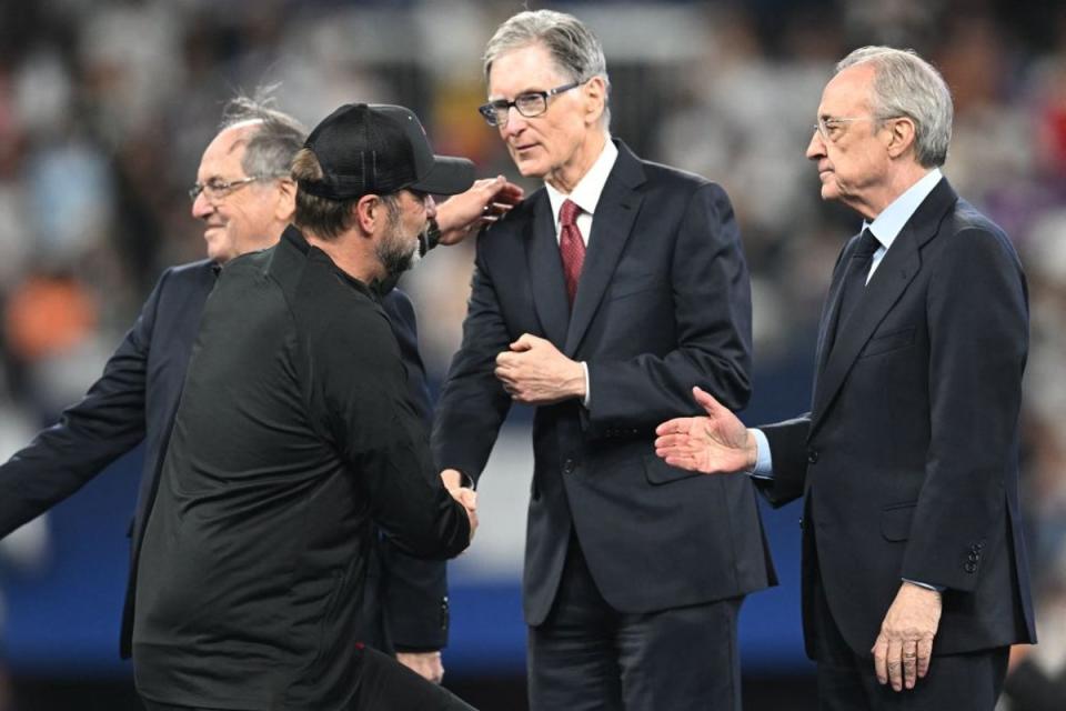 Klopp shakes hands with Liverpool owner John W Henry (AFP via Getty Images)