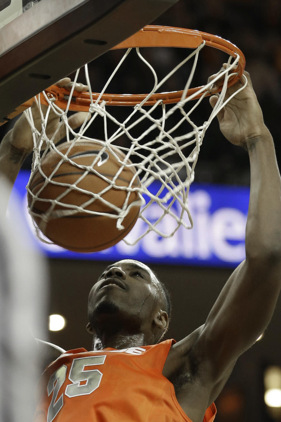 Syracuse forward Rakeem Christmas (25) watches his dunk during the first half of an NCAA College basketball game in Charlottesville, Va., Saturday, March 1, 2014. (AP Photo/Steve Helber)