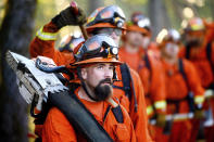 Inmate firefighters prepare to battle the Kincade Fire near Healdsburg, Calif., on Tuesday, Oct. 29, 2019. (AP Photo/Noah Berger)