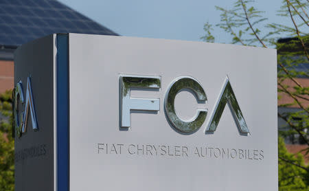 FILE PHOTO: A Fiat Chrysler Automobiles (FCA) sign is seen at its U.S. headquarters in Auburn Hills, Michigan, U.S. May 25, 2018. REUTERS/Rebecca Cook