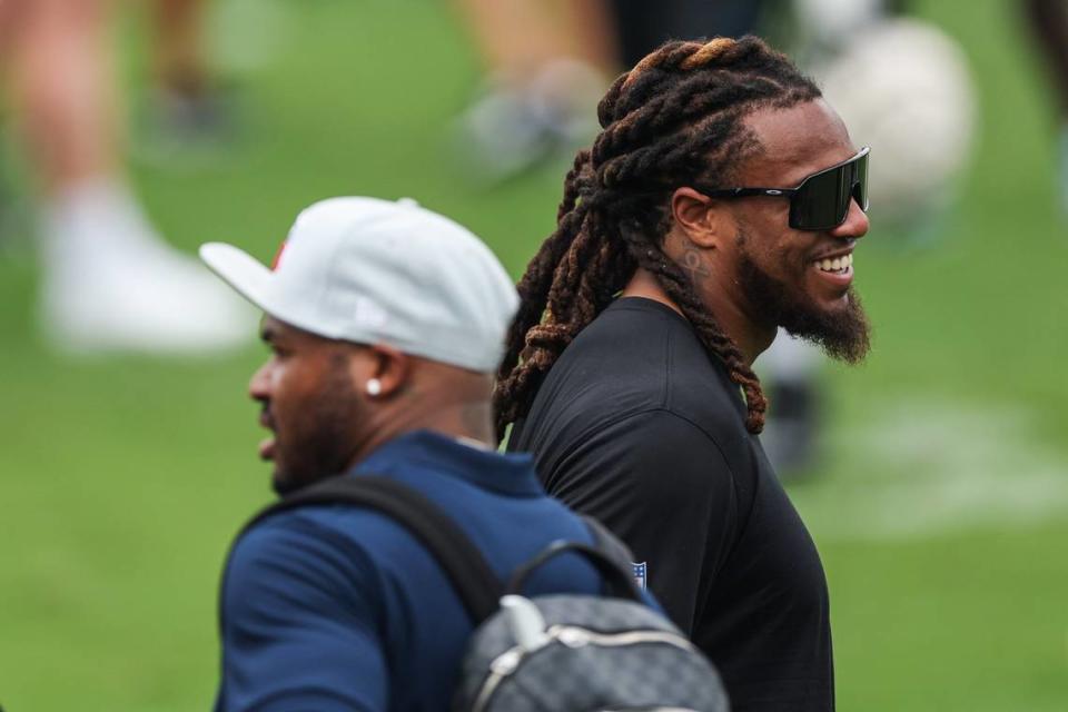 Panthers linebacker Shaq Thompson, right, smiles during a conversation with former wide receiver Steve Smith, Sr. on the sideline at the Back Together practice in Gibbs Stadium at Wofford College on Saturday, July 30, 2022 in Spartanburg, SC.