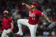 Cincinnati Reds' Fernando Cruz celebrates as he walks to the dugout after the final out in the top of the seventh inning of the team's baseball game against the Philadelphia Phillies in Cincinnati, Wednesday, April 24, 2024. (AP Photo/Aaron Doster)