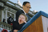 FILE - Andrew Giuliani, left, yawns as his father, New York Mayor Rudolph Giuliani addresses the crowd after being sworn-in as the 107th Mayor of New York, Jan. 2, 1994. One place the former New York City mayor is in high demand these days is on the campaign of his son, Andrew Giuliani, who on Tuesday is hoping to become the Republican nominee for governor of New York. (AP Photo/Mike Albans, File)