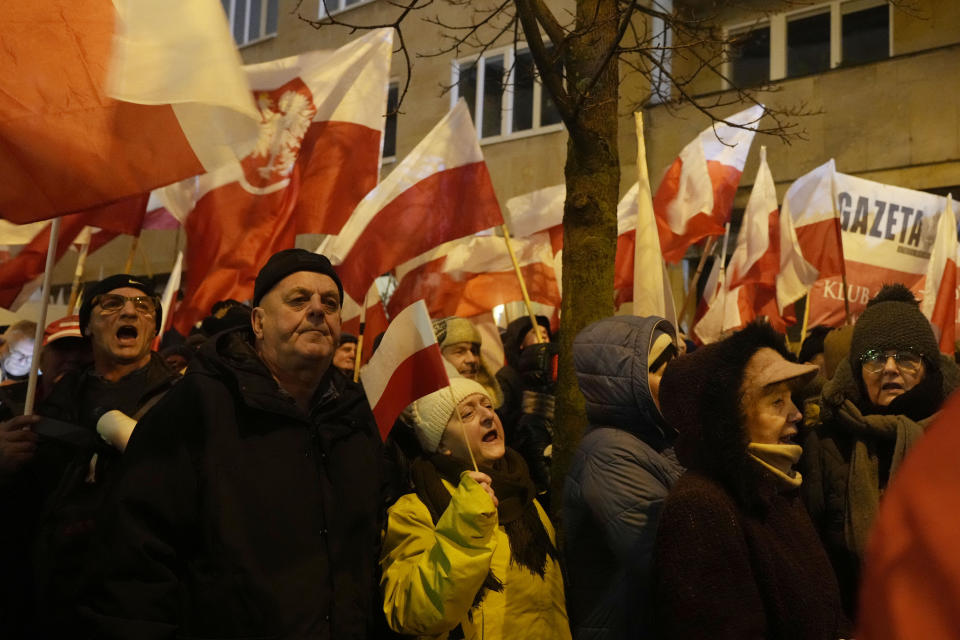 Supporters of right-wing Law and Justice party protest before the parliament building in Warsaw, Poland, on Thursday, Jan. 11, 2024. Law and Justice, frustrated over its recent loss of power, urged its supporters to protest moves by the new pro-European Union government to take control of state media. It also said it was protesting the arrests Tuesday of two senior members of Law and Justice, former Interior Minister Mariusz Kaminski and his former deputy, Maciej Wasik. (AP Photo/Czarek Sokolowski)