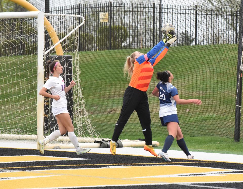 Lenawee Christian's Avery Sluss reaches to snag a corner kick during a game against Adrian at Adrian College in the 2023 season.