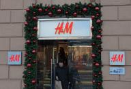 A woman walks out of an H&M store in Moscow