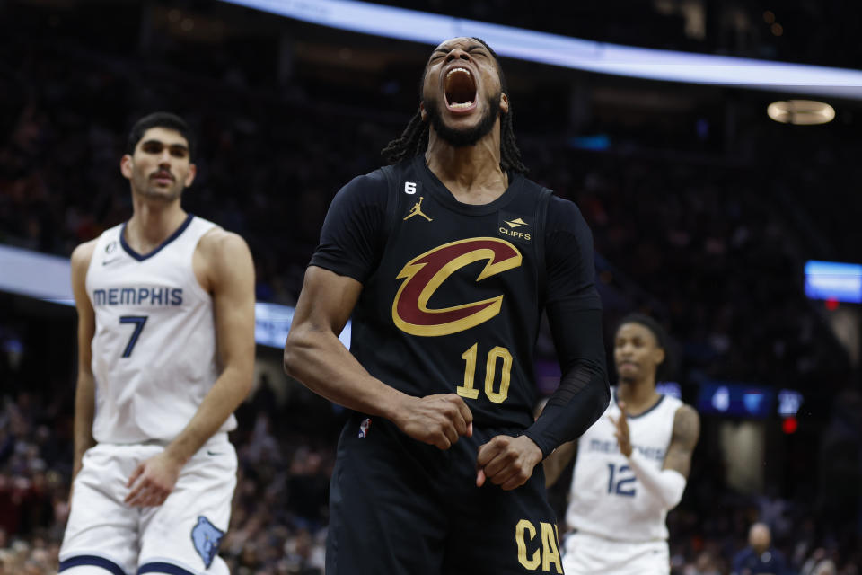 Cleveland Cavaliers guard Darius Garland (10) celebrates after scoring against the Memphis Grizzlies during the second half of an NBA basketball game, Thursday, Feb. 2, 2023, in Cleveland. (AP Photo/Ron Schwane)