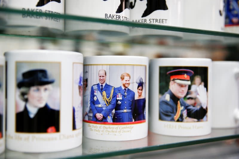 Merchandise depicting Britain's Prince Harry and Meghan, Duchess of Sussex, are seen on display in a souvenir shop near Buckingham Palace in London