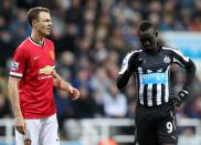 Manchester United's Northern Irish defender Jonny Evans (L) has rejected allegations of spitting at Newcastle United's Senegalese striker Papiss Cisse (R) during their match in March 4, 2014