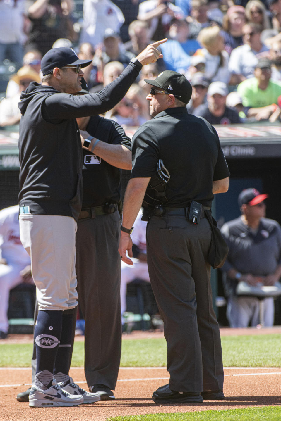 New York Yankees manager Aaron Boone argues a call with umpires during the first inning of a baseball game against the Cleveland Guardians in Cleveland, Wednesday April 12, 2023. Boone was ejected from the game. (AP Photo/Phil Long)