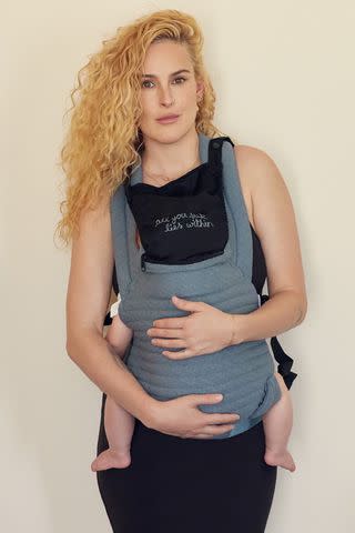 <p>Courtesy of BUMPSUIT</p> Rumer Willis with baby Louetta in "Lou Blue" Armadillo carrier