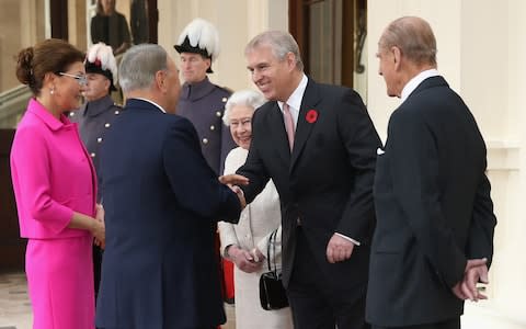 Nursultan Nazarbayev and his daughter Dariga meet the Queen, Prince Andrew and Prince Philip at Buckingham Palace in 2015 - Credit: Chris Jackson/Getty