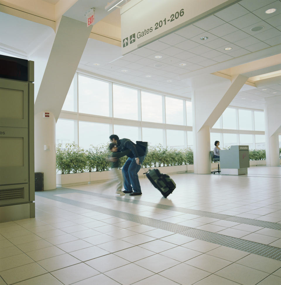 A father and son are reunited at the airport