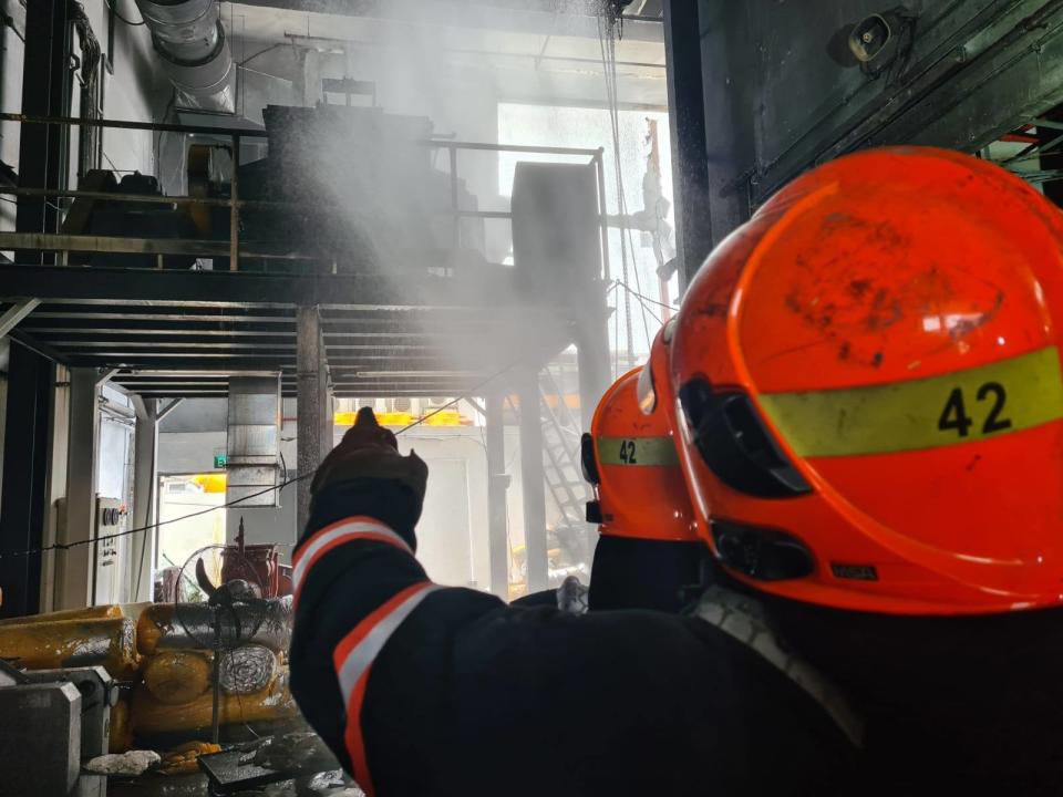 SCDF officers putting out the fire at the unit in the Platinum@Pioneer building on 24 February 2021. (PHOTO: Singapore Civil Defence Force Facebook page)