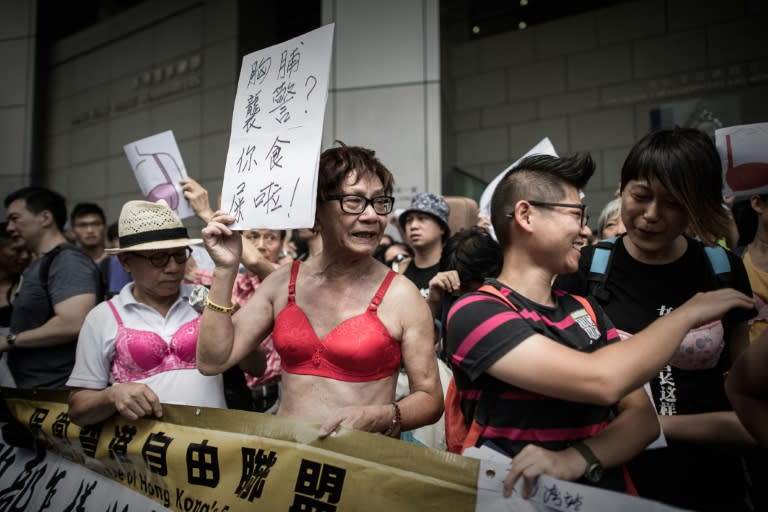 Protesters in bras demonstrate outside police headquarters in Hong Kong on August 2, 2015 in support of a woman who was sentenced to jail for assaulting a police officer with her breast