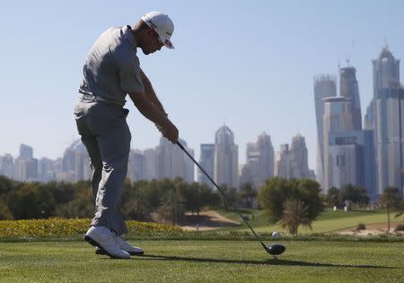 Trevor Fisher Jr. of South Africa tees off on the eighth hole during the Dubai Desert Classic golf championship February 6, 2016. REUTERS/Ahmed Jadallah