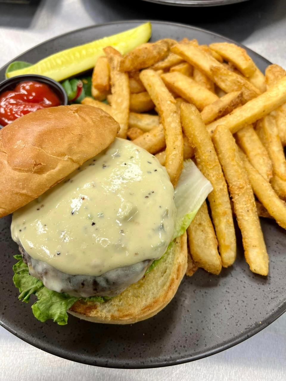 The Huntsman at The Charred Oak Tavern in Middleboro is made with elk, bison, wagyu and wild boar, and topped with cheddar cheese.