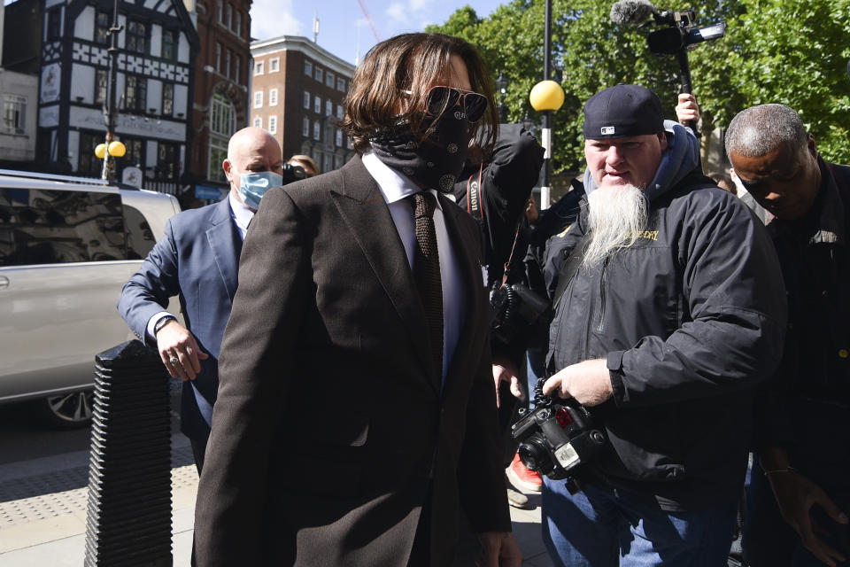 Johnny Depp arrives at the High Court in London, Friday July 10, 2020. Depp is back in the witness box at the trial of his libel suit against a tabloid newspaper that called him a "wife-beater" in an April 2018 article that said he'd physically abused ex-wife Amber Heard. Depp strongly denies the allegations. (AP Photo/Alberto Pezzali)