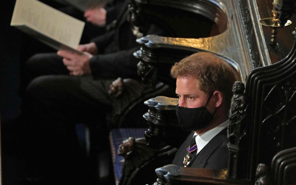 The Duke of Sussex was seated opposite his brother during the ceremony at St George's Chapel - AFP