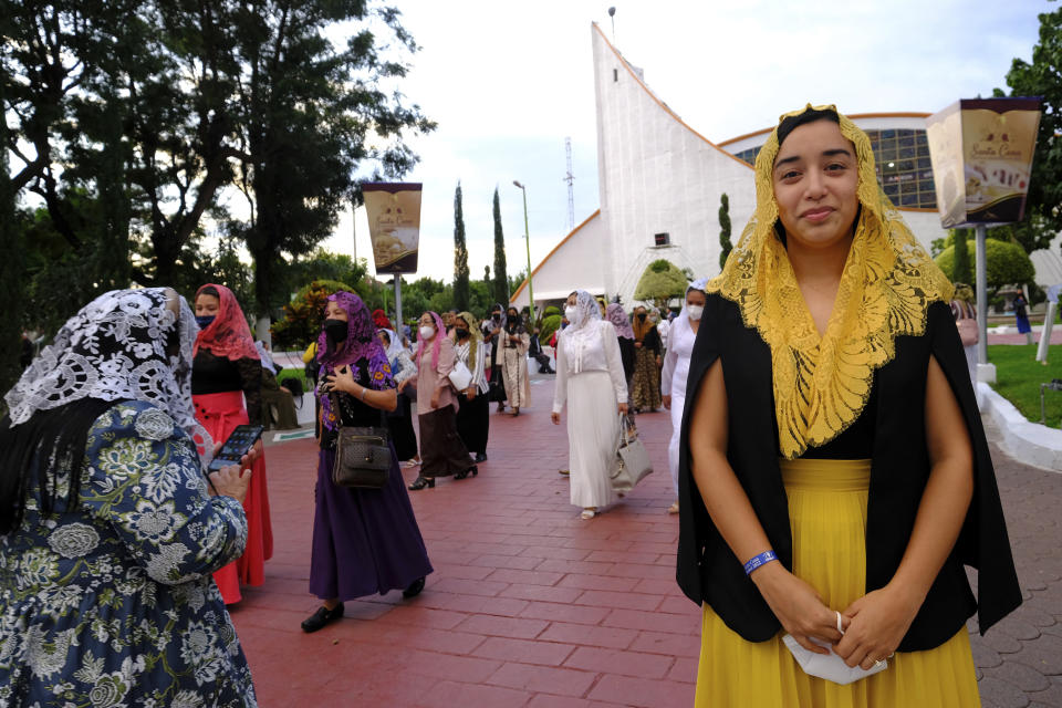 Congregant Sailem Castillo poses for a photo outside the La Luz del Mundo, Spanish for The Light of the World, in the Bethel neighborhood of Guadalajara, Mexico, Saturday, Aug. 13, 2022. Castillo said she remains upbeat despite the imprisonment of their church leader Naason Joaquin García who is serving a 16-year sentence in California after pleading guilty to sexually abusing minors. (AP Photo/Refugio Ruiz)