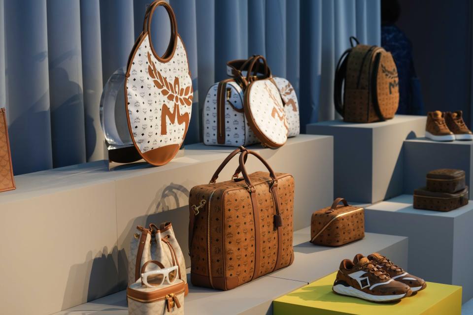 Travel bags and accessories are displayed at the MCM showroom part of the Spring Summer 2024 collection presented in Milan, Italy, Sunday, June 18, 2023. (AP Photo/Luca Bruno)