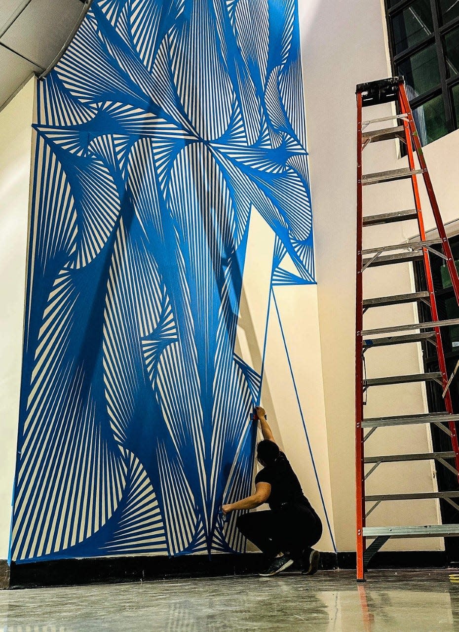 El Paso-based artist Laura Turón works on one of her installations in the Stanlee and Gerald Rubin Center for the Visual Arts exhibit, “Laura Turón: Immersive Abstractions,” which looks back at nearly 10 years of her work. The exhibit opens Thursday and runs through March 10.