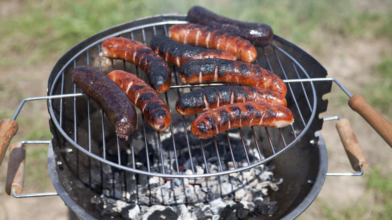 Burnt sausages on the grill