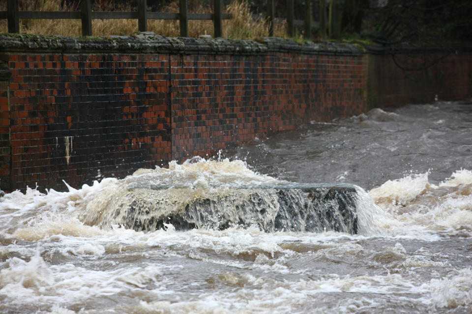 Water rushes at the River Calder on Tuesday morning.