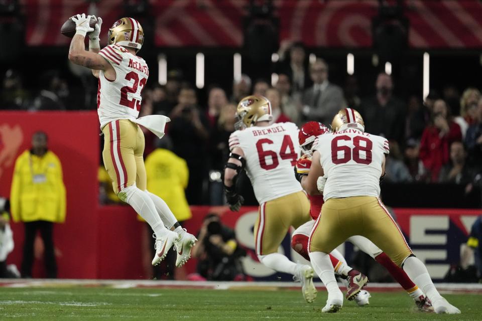 San Francisco 49ers running back Christian McCaffrey (23) makes the catch against the Kansas City Chiefs during the first half of the NFL Super Bowl 58 football game Sunday, Feb. 11, 2024, in Las Vegas. McCaffrey scored on the play. (AP Photo/John Locher)