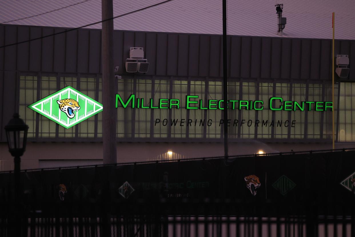 A sign illuminates the Miller Electric Center practice facility at EverBank Stadium after its opening last summer at the Jacksonville Jaguars practice facility. A woman crashed through a pair of gates and into front glass doors Monday.