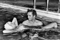 <p>Elvis Presley and his <em>Jailhouse Rock</em> costar Jennifer Holden spend time together in a pool, circa 1957.</p>