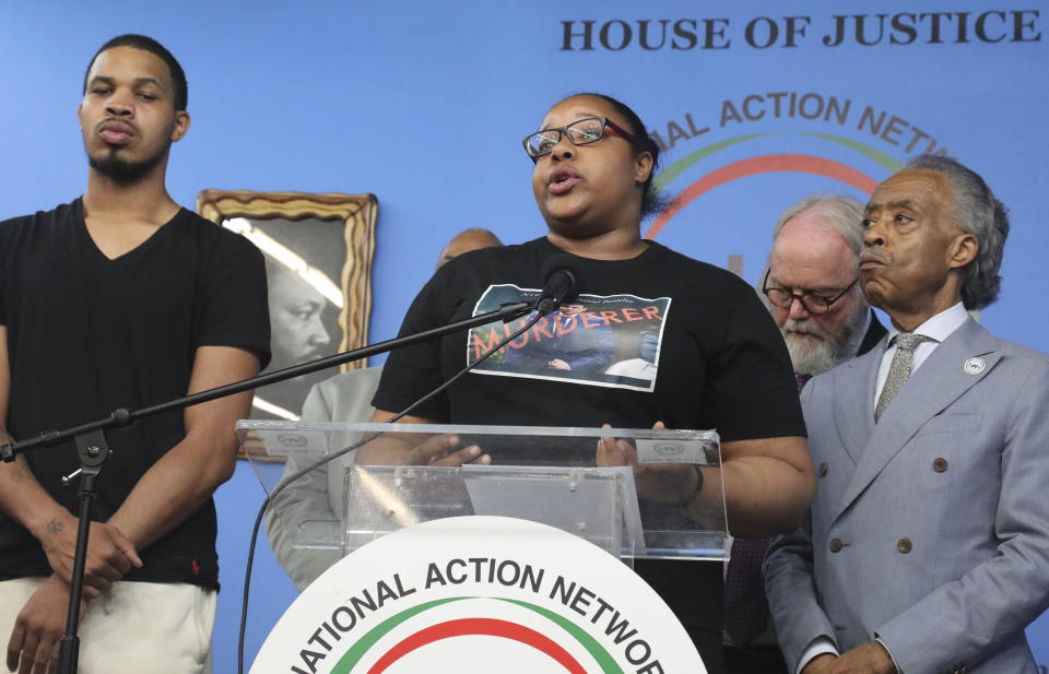 Eric Garner Jr, far left, and his sister Emerald Garner, second from left, the children of chokehold victim Eric Garner, join Rev. Al Sharpton, far right, founder of the National Action Network (NAN), at a press conference after NYPD Commissioner James O'Neill announced his decision to fire NYPD officer Daniel Pantaleo for the 2014 chokehold death of Eric Garner, Monday Aug. 19, 2019, at NAN headquarters in New York. ( AP Photo/Bebeto Matthews)