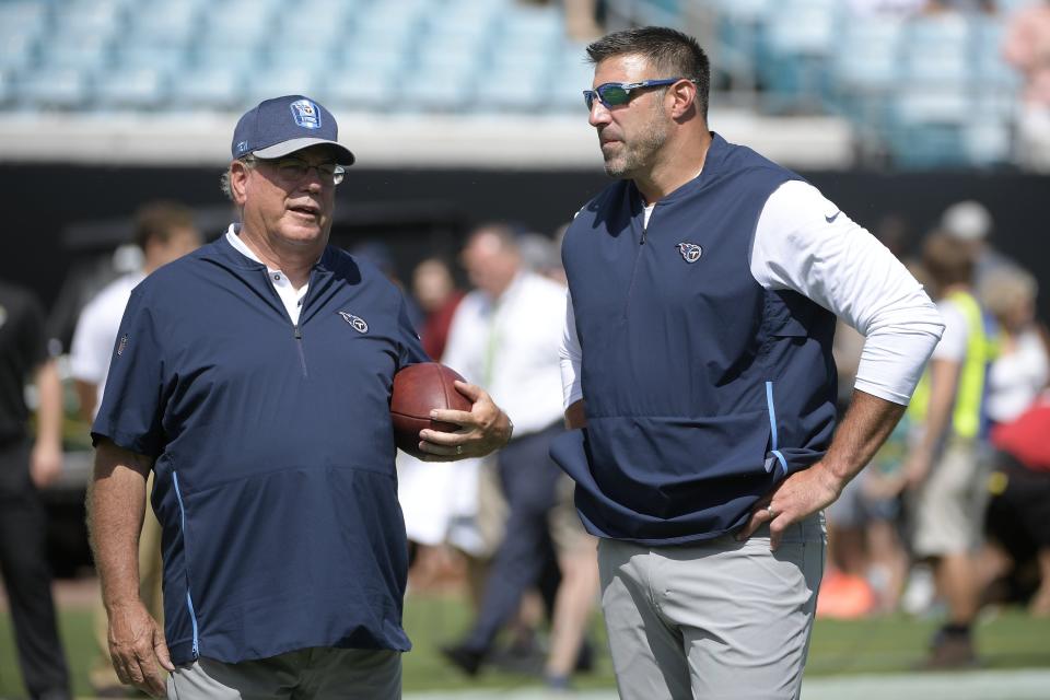 Tennessee Titans coach Mike Vrabel, right, talks with defensive coordinator Dean Pees before a game against the Jacksonville Jaguars on Sept. 23, 2018, in Jacksonville, Fla.