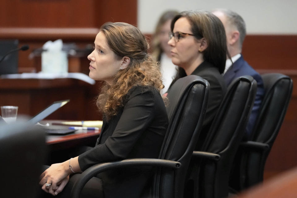 Attorney's Camila Vega with Planned Parenthood, left, and Julie Murray with the ACLU, listens to oral arguments involving Utah's abortion trigger law before the Utah Supreme Court, Tuesday, Aug. 8, 2023, in Salt Lake City. The state Supreme Court is weighing a lower court's decision to put a law banning most abortions on hold more than a year ago. (Francisco Kjolseth/The Salt Lake Tribune via AP, Pool)