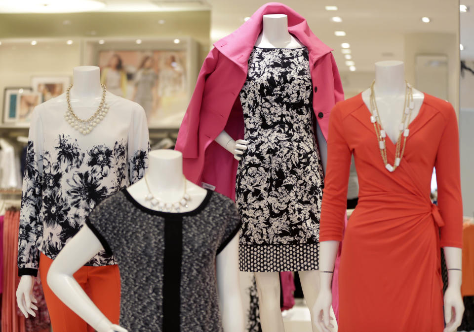 In this Wednesday, Jan. 23, 2013 photo, clothing is displayed at an Ann Taylor store in White Plains, N.Y. The store is set up like a closet, without a specific “suits section” or all the denim tucked in the back corner. Displays are more likely to be built around a color theme, or a versatile item. (AP Photo/Seth Wenig)