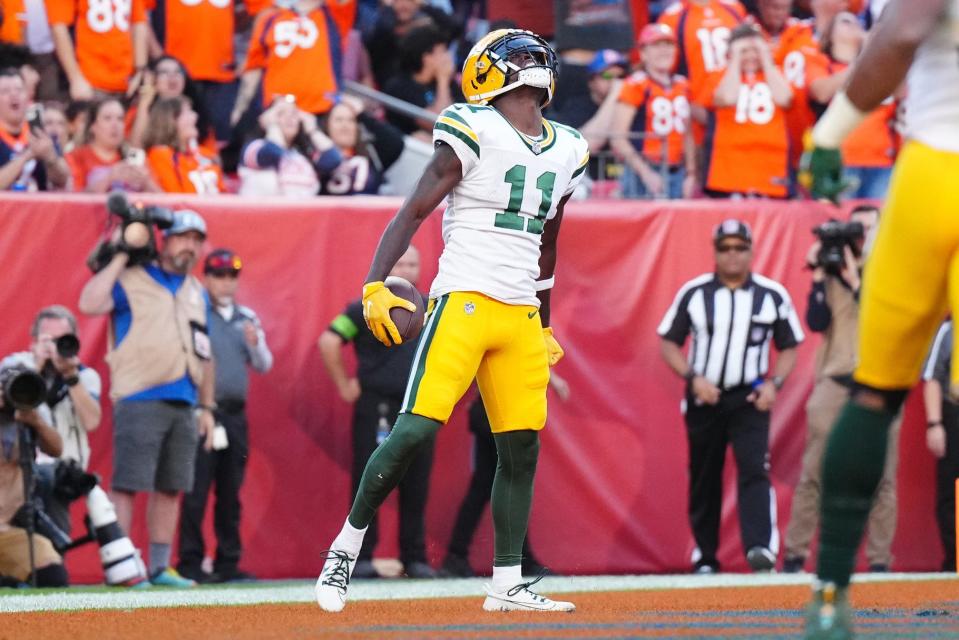 Green Bay Packers wide receiver Jayden Reed celebrates a touchdown reception in the second half against the Denver Broncos at Empower Field.