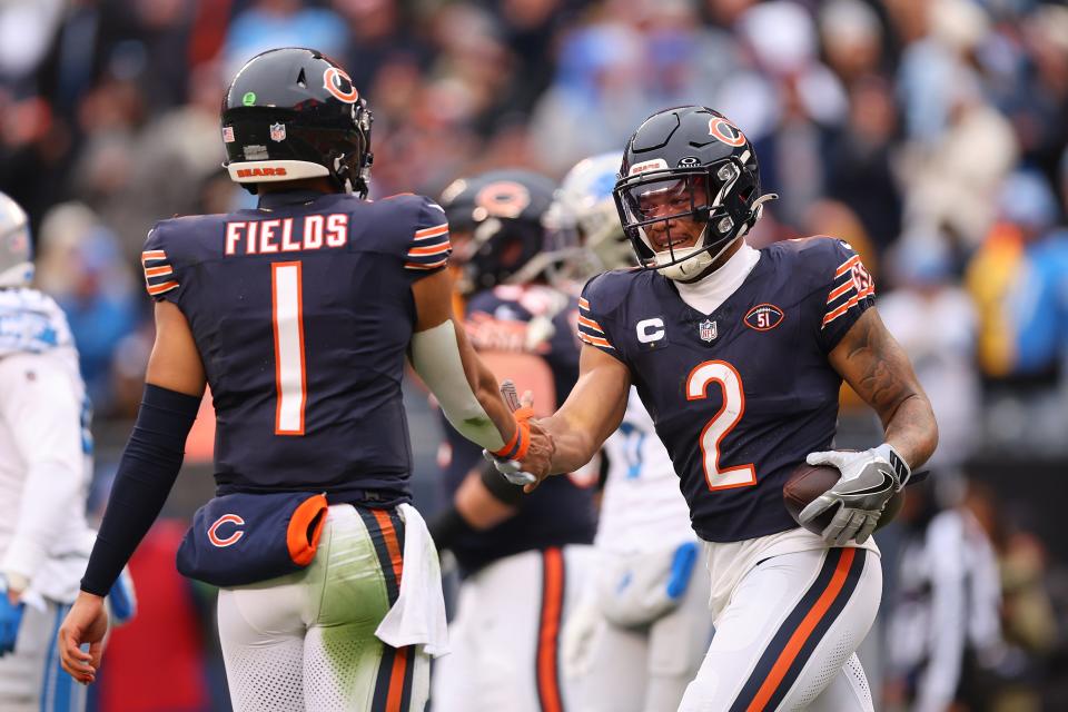 CHICAGO, ILLINOIS - DECEMBER 10: DJ Moore #2 of the Chicago Bears celebrates after a touchdown with Justin Fields #1 during the first quarter in the game against the Detroit Lions at Soldier Field on December 10, 2023 in Chicago, Illinois. (Photo by Michael Reaves/Getty Images) ORG XMIT: 775992450 ORIG FILE ID: 1845325808